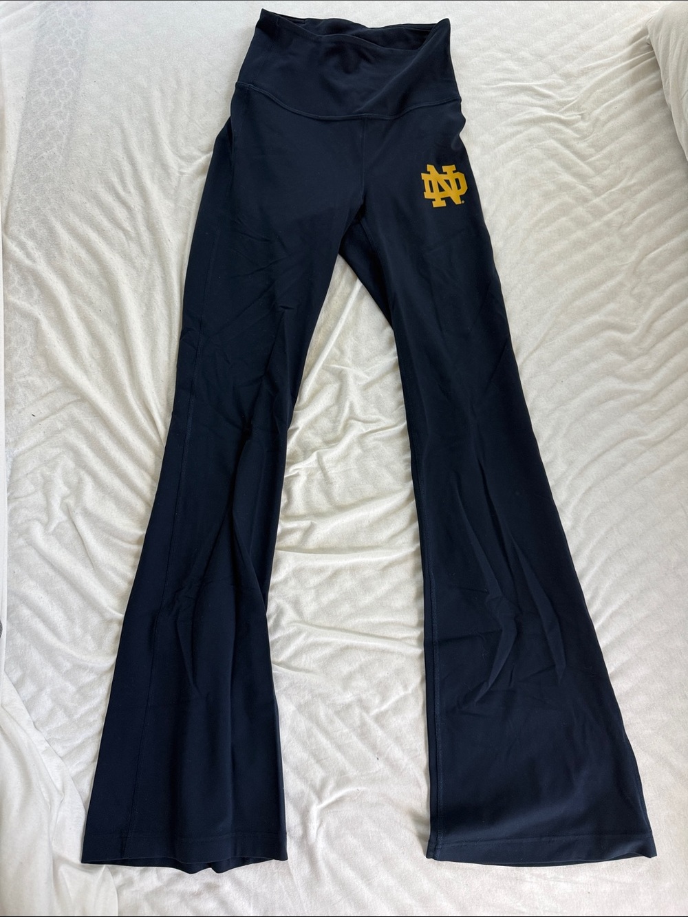 lululemon athletica Black Flared Athletic Pants with Gold Logo